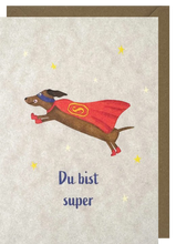 Lade das Bild in den Galerie-Viewer, Postkarte Dackel Superheld, inkl. Couvert
